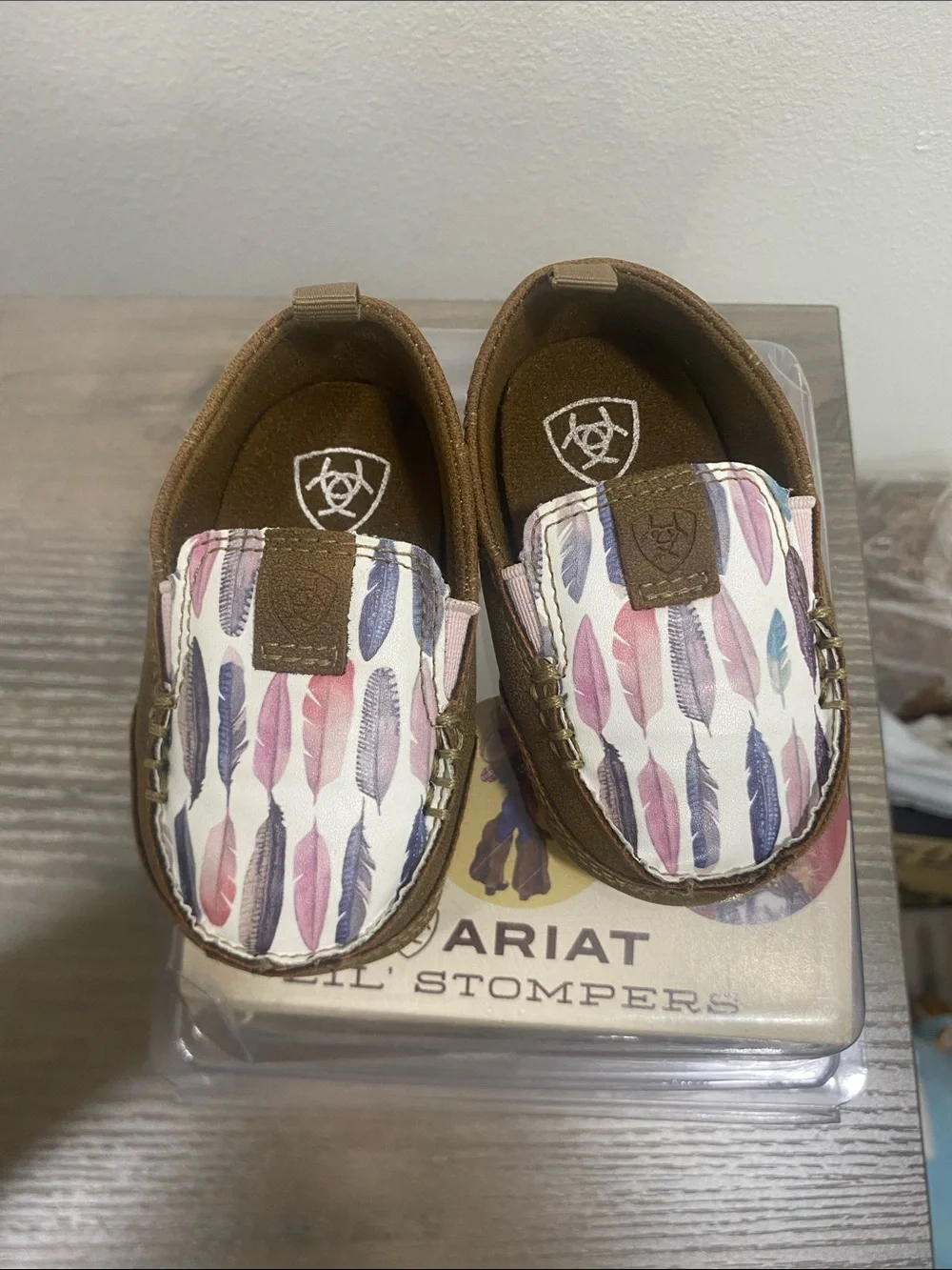 Ariat Kids Brown Moccasins with Pink Purple and Blue Feather Print